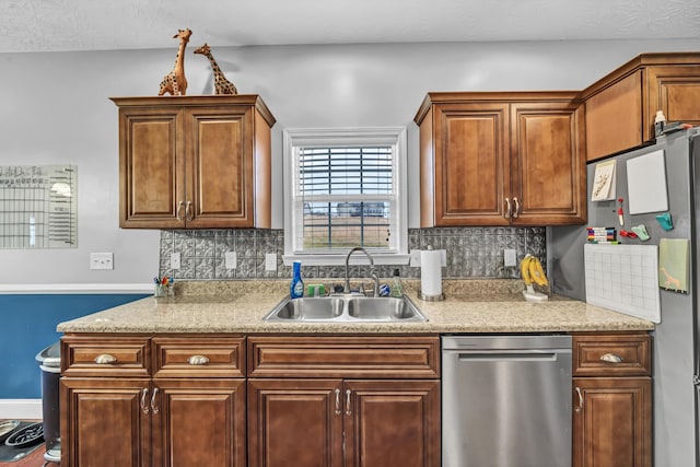 kitchen with tasteful backsplash, sink, and stainless steel appliances