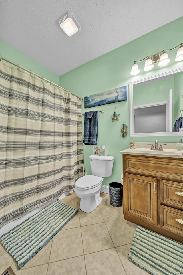 bathroom with tile patterned flooring, vanity, toilet, and a shower with shower curtain