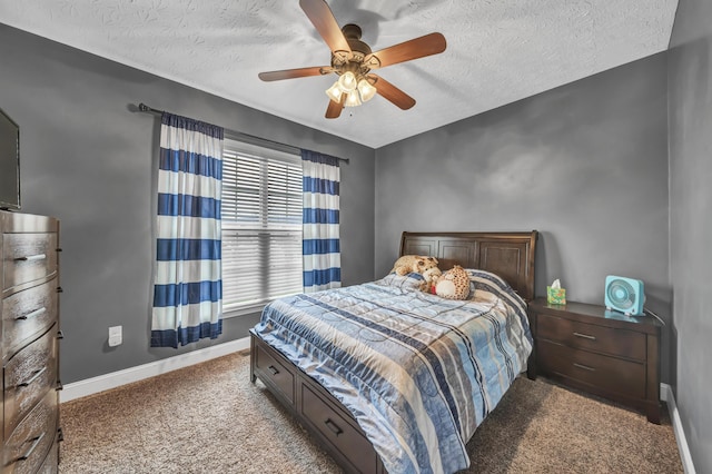 carpeted bedroom featuring ceiling fan, a textured ceiling, and multiple windows