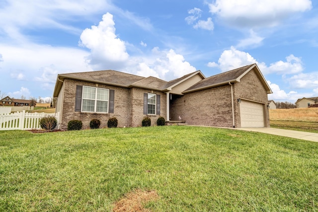 ranch-style home featuring a garage and a front yard