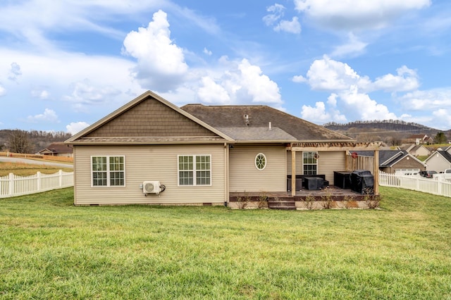 back of house featuring a yard