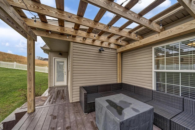 wooden terrace with a yard and an outdoor living space