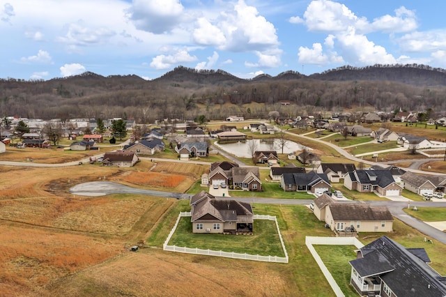 birds eye view of property with a mountain view