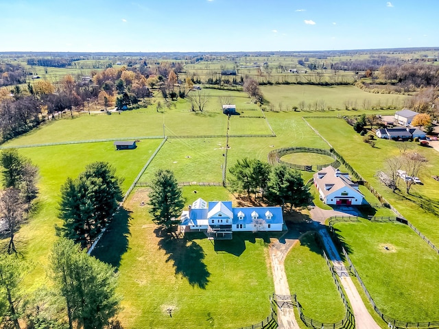 birds eye view of property with a rural view