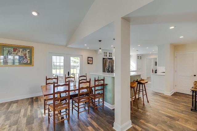 dining space with lofted ceiling, ceiling fan, and dark hardwood / wood-style floors