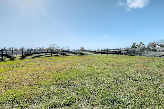 view of yard with a rural view