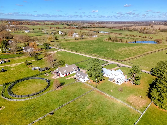 drone / aerial view featuring a rural view and a water view