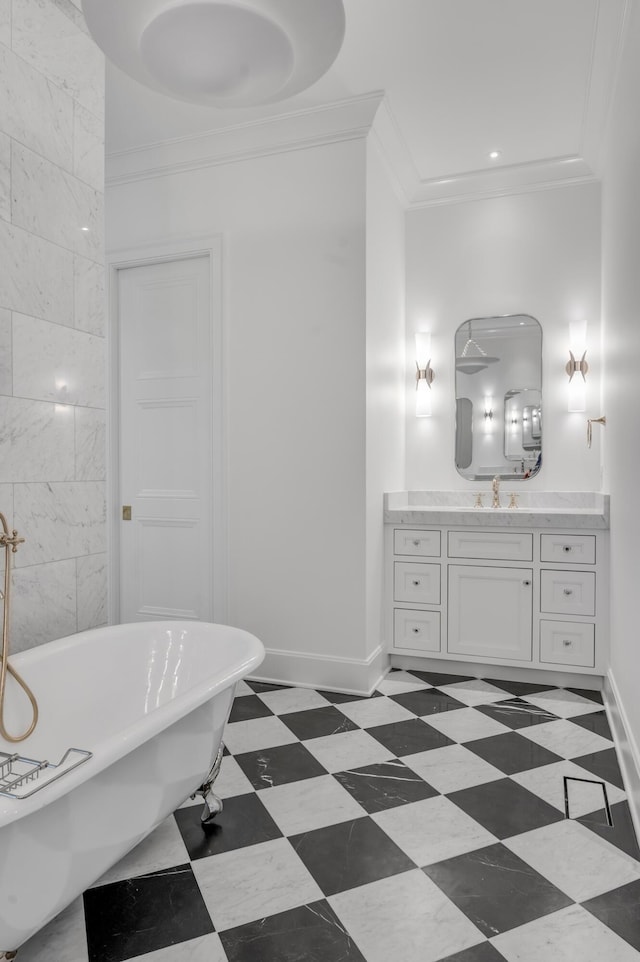 bathroom with vanity, a bath, and ornamental molding