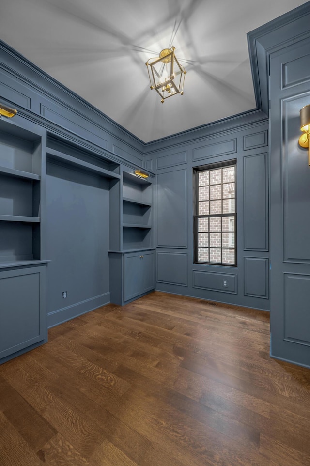 interior space featuring dark hardwood / wood-style floors and a notable chandelier