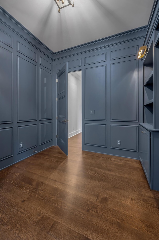 spare room featuring dark hardwood / wood-style flooring