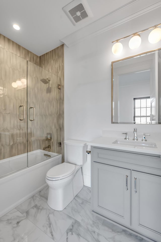 full bathroom featuring vanity, toilet, ornamental molding, and enclosed tub / shower combo