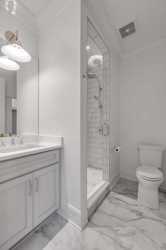 bathroom featuring toilet, a tile shower, ornamental molding, and vanity