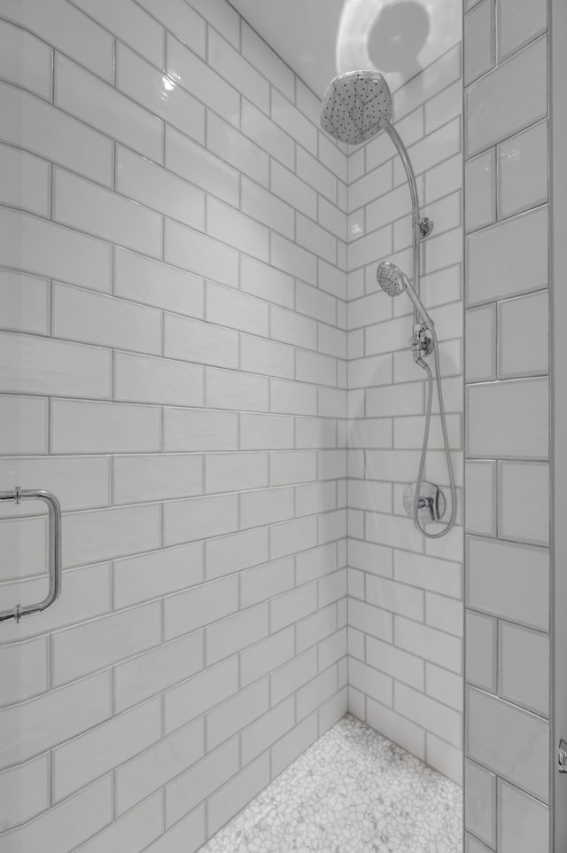 bathroom with a tile shower