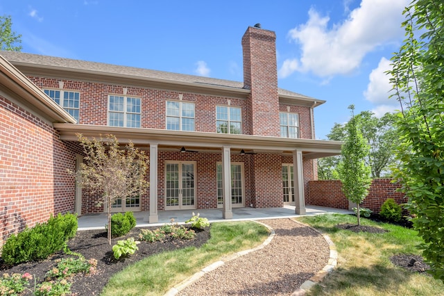 back of property with a patio and ceiling fan