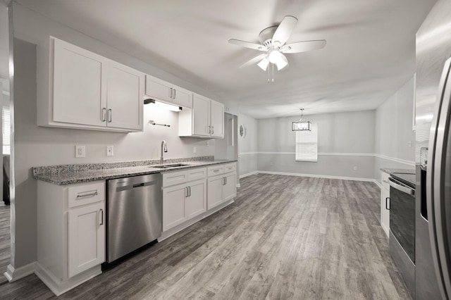 kitchen featuring white cabinets, appliances with stainless steel finishes, ceiling fan, and sink