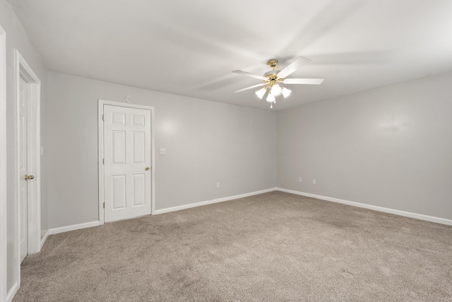 carpeted empty room featuring ceiling fan