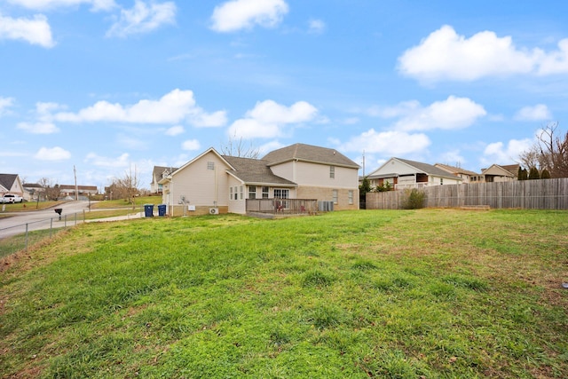 rear view of house with a lawn