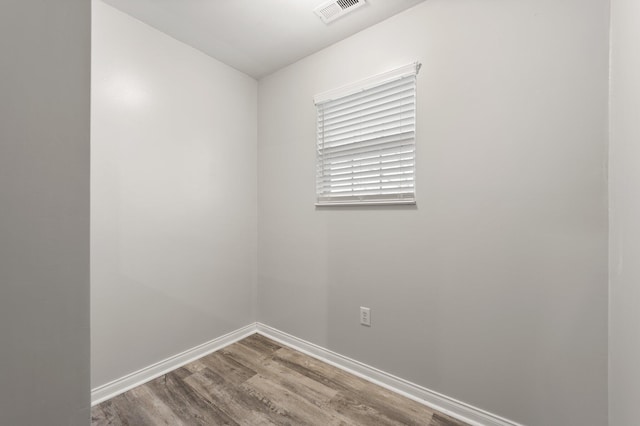 empty room with wood-type flooring