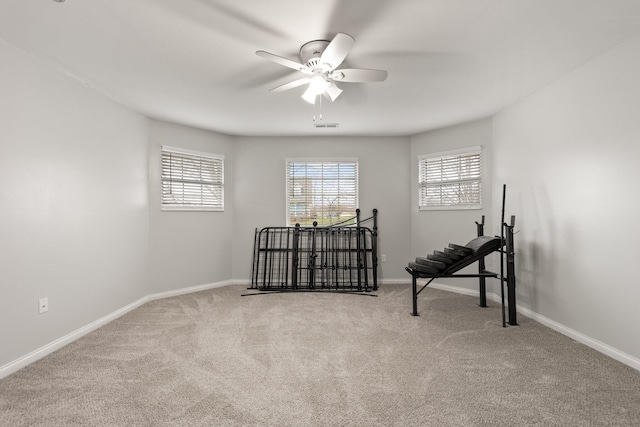 spare room featuring carpet and ceiling fan