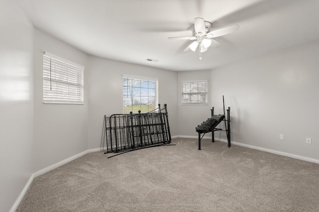 unfurnished room with carpet and ceiling fan