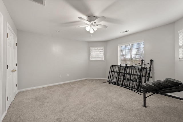 bedroom featuring ceiling fan and light colored carpet