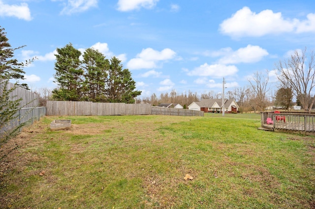 view of yard featuring a wooden deck