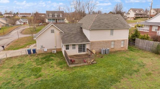 back of property with a yard and cooling unit