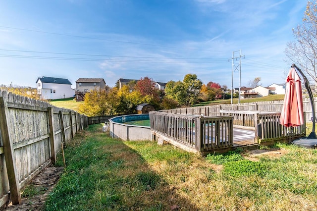 view of yard featuring a pool side deck