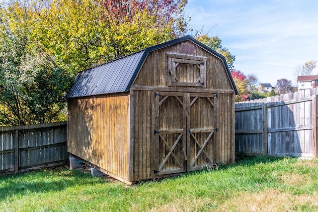 view of outbuilding with a lawn