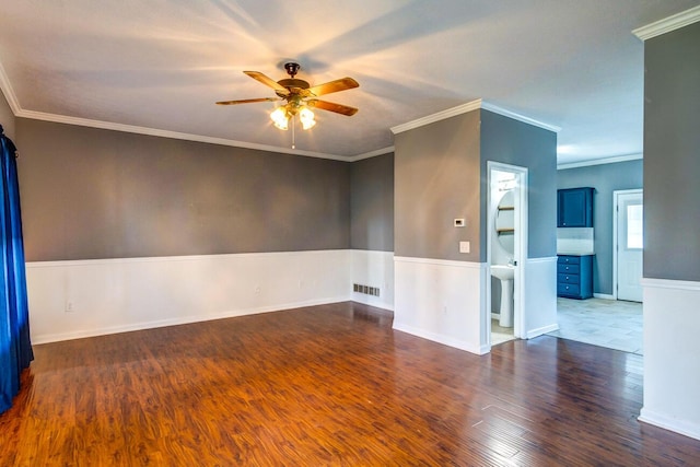 unfurnished room featuring crown molding, ceiling fan, and dark hardwood / wood-style floors