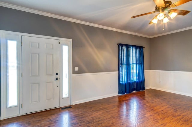 entryway featuring ceiling fan, dark hardwood / wood-style floors, and ornamental molding