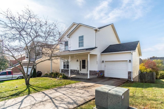 view of front property with covered porch, a front yard, and a garage