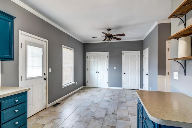 kitchen featuring blue cabinetry, ceiling fan, and crown molding