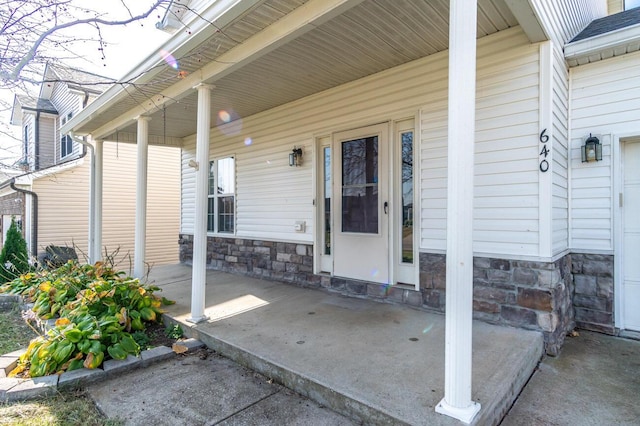 doorway to property with covered porch