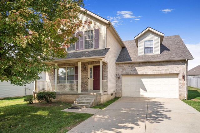 view of front of house with a garage and a front lawn