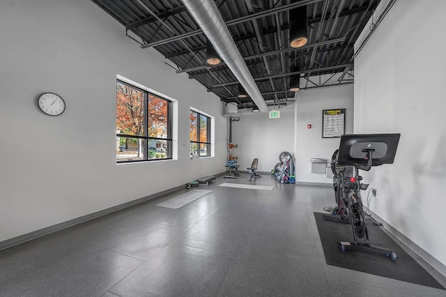 exercise area with a towering ceiling