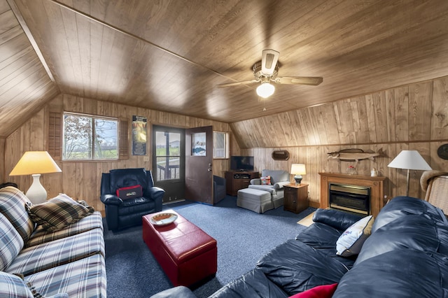 living room with ceiling fan, carpet floors, vaulted ceiling, wooden walls, and wood ceiling