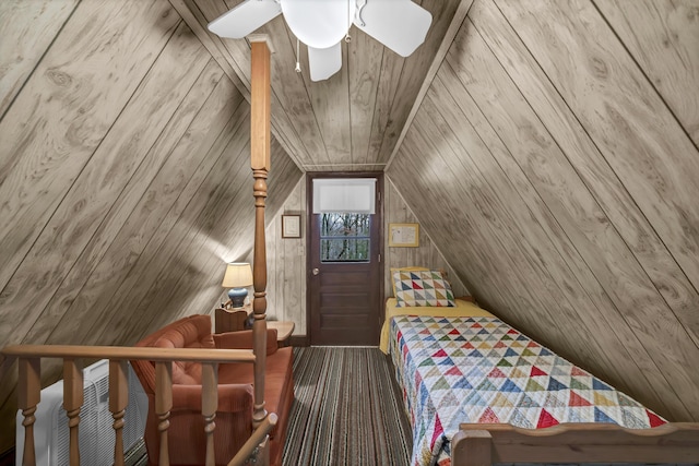 bedroom with lofted ceiling, wood walls, wooden ceiling, and ceiling fan