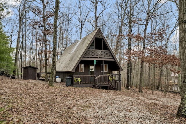 view of front of home featuring a storage shed