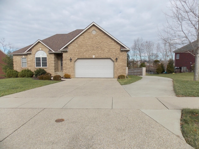 view of front of home featuring a garage and a front yard