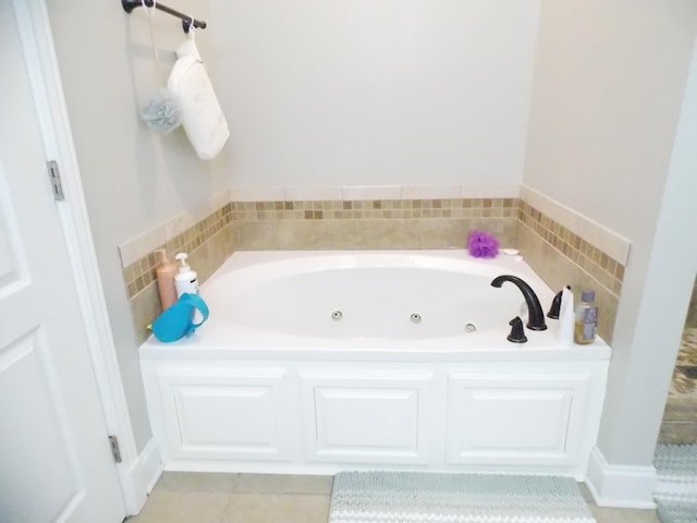 bathroom with tile patterned flooring and a bathing tub