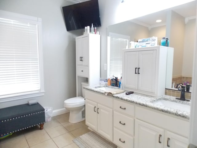 bathroom with vanity, tile patterned floors, crown molding, and toilet