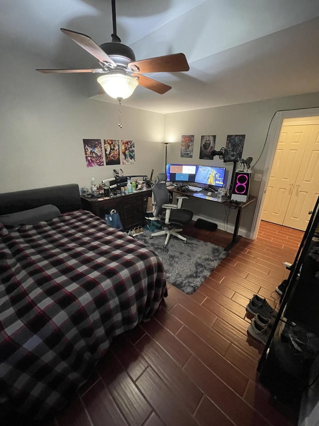 bedroom with hardwood / wood-style floors and ceiling fan