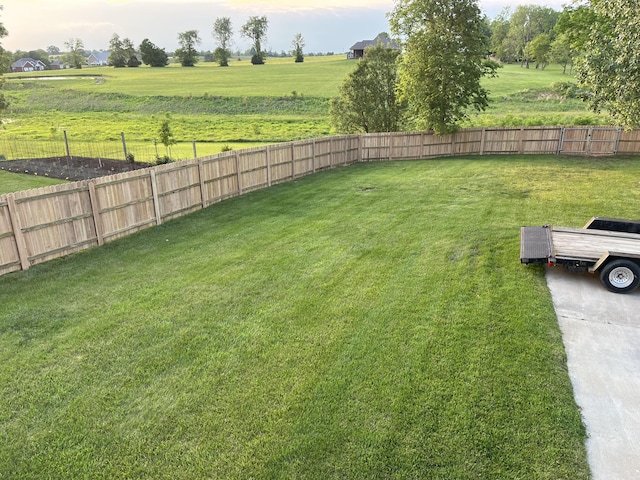 view of yard with a rural view