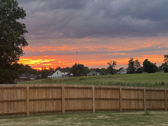 view of yard at dusk