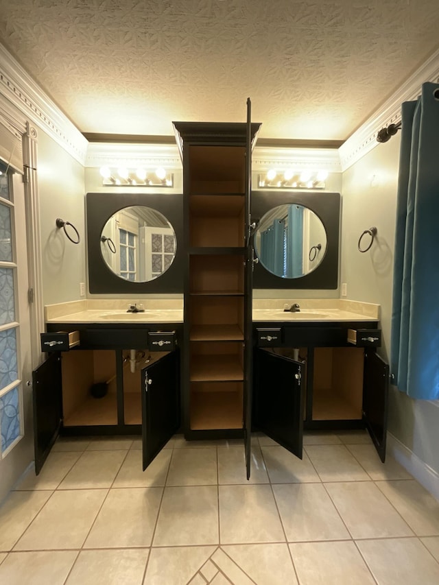 bathroom featuring crown molding, tile patterned floors, and a textured ceiling