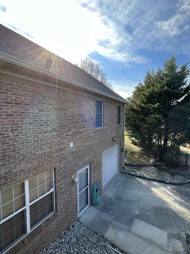 view of property exterior with a garage