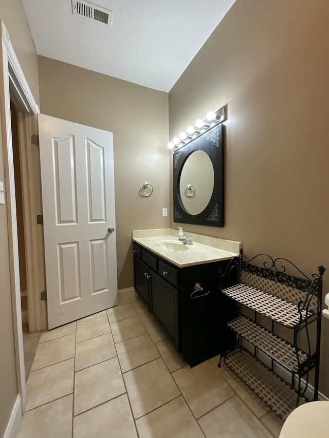 bathroom featuring vanity and tile patterned flooring