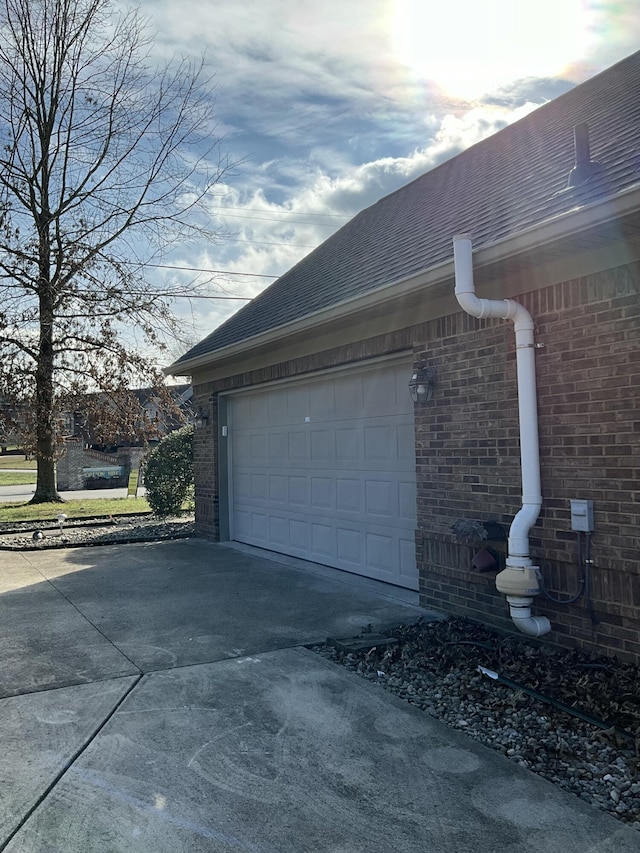 view of side of property featuring a garage