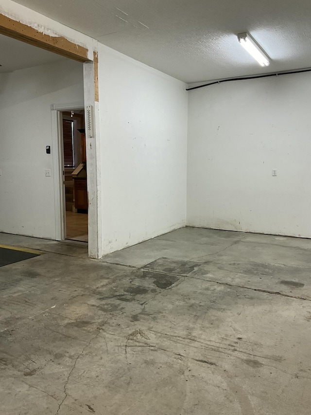 spare room with concrete flooring